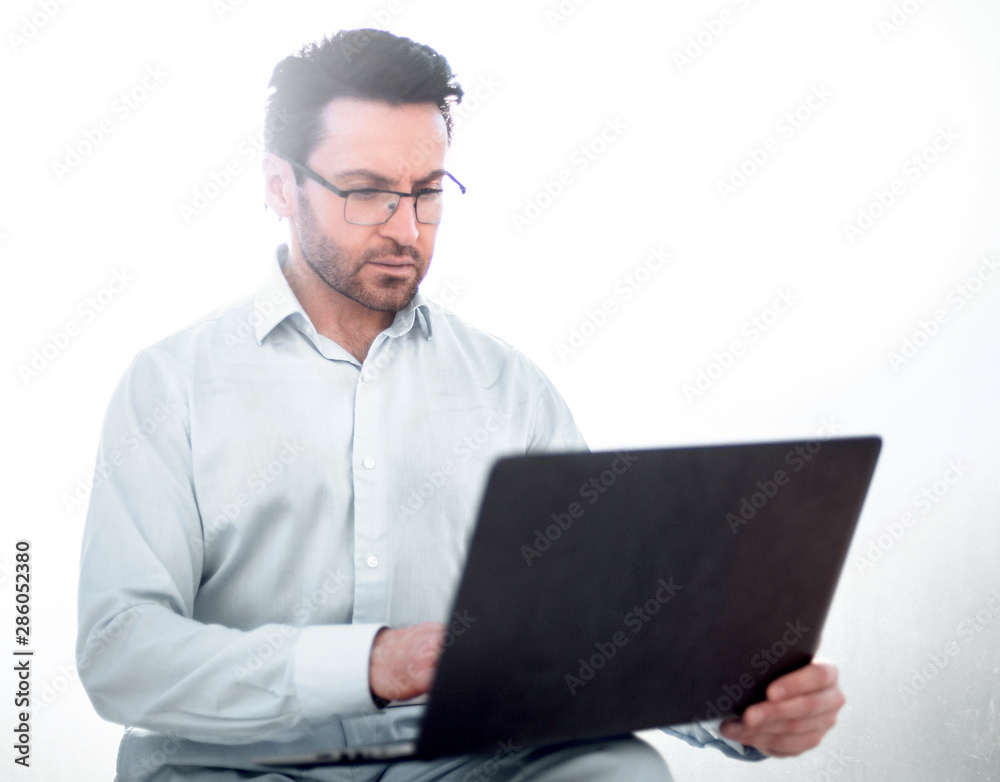 close up.modern businessman is using a laptop. close up.modern businessman is using a laptop.