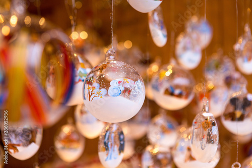 Photography Christmas souvenirs on the counter in Europe, Painted glass Christmas balls with fairy tales