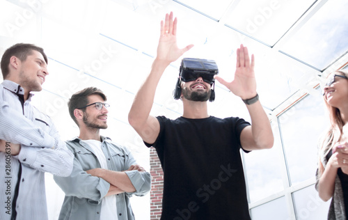 Businessman making gestures when wearing virtual reality goggles