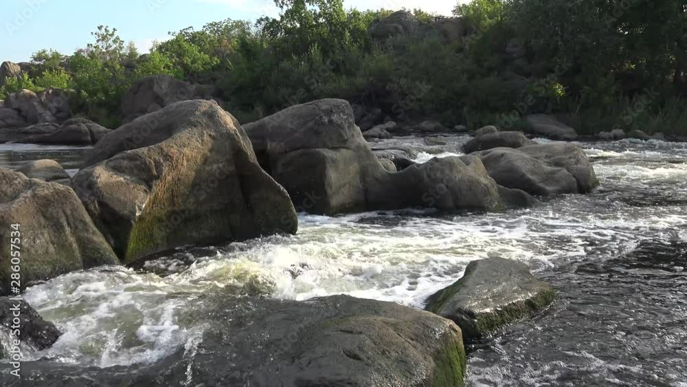 Granite rapids and rapids with rapidly flowing water on the South Bug River, Ukraine Granite rapids and rapids with rapidly flowing water on the South Bug River, Ukraine