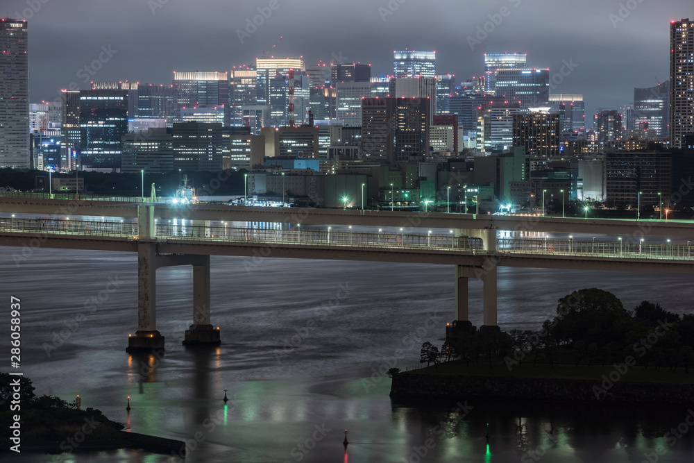 Panoramic modern city skyline bird eye aerial view of Tokyo bay under rainy night