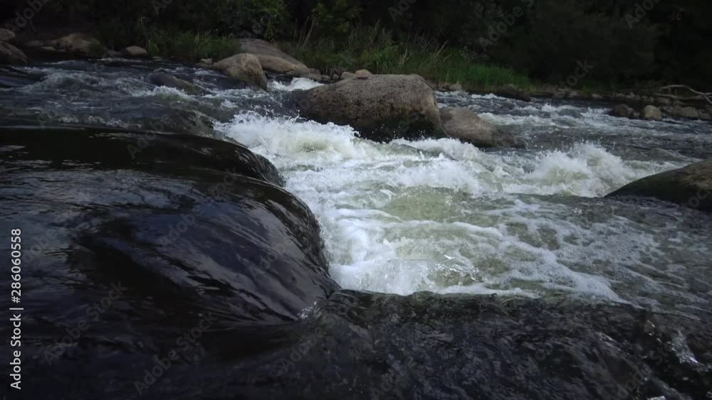 Granite rapids and rapids with rapidly flowing water on the South Bug River, Ukraine Granite rapids and rapids with rapidly flowing water on the South Bug River, Ukraine