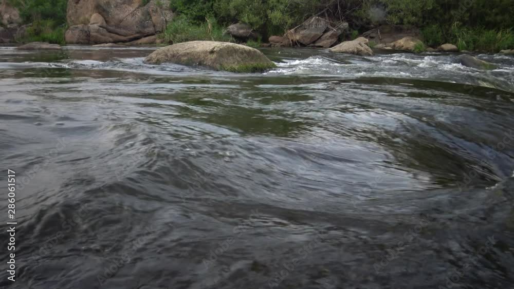 Granite rapids and rapids with rapidly flowing water on the South Bug River, Ukraine Granite rapids and rapids with rapidly flowing water on the South Bug River, Ukraine
