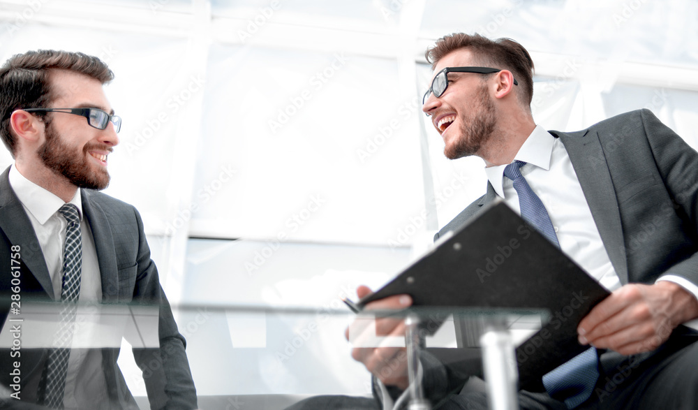 bottom view.business partners are engaged in a dialogue at the negotiating table bottom view.business partners are engaged in a dialogue at the negotiating table