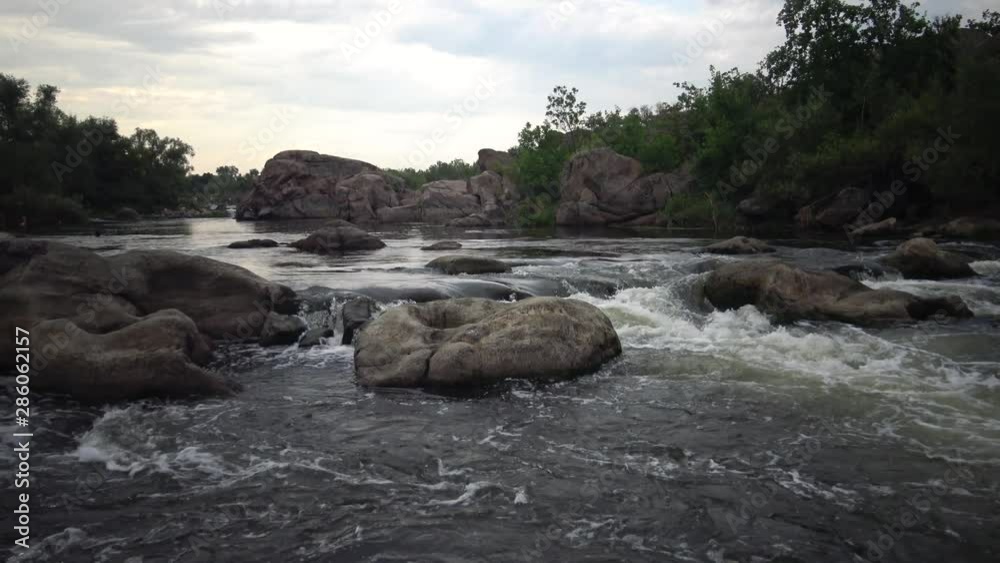 Granite rapids and rapids with rapidly flowing water on the South Bug River, Ukraine Granite rapids and rapids with rapidly flowing water on the South Bug River, Ukraine