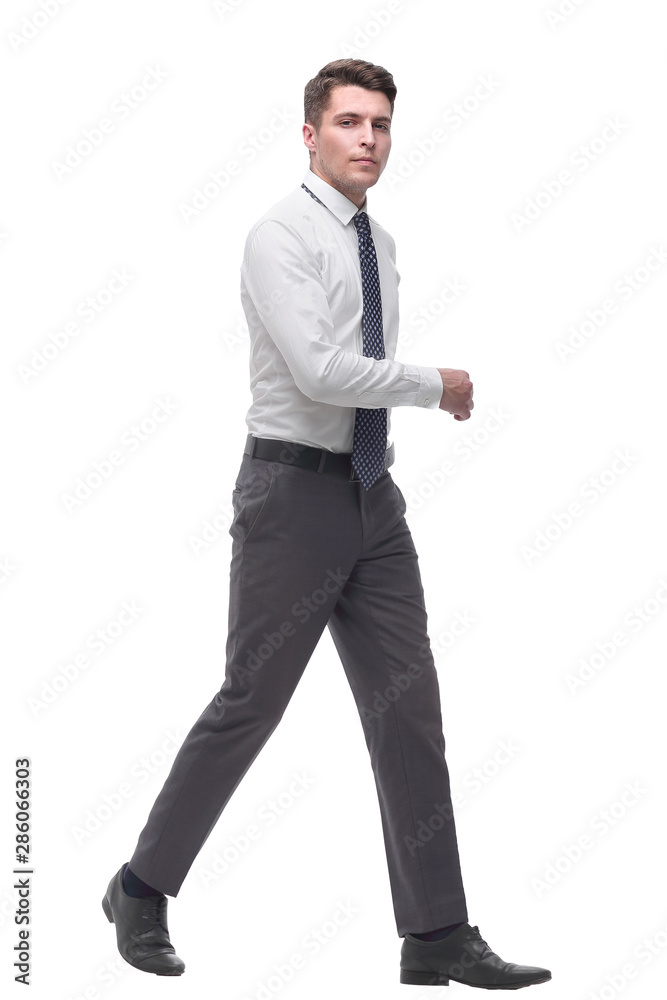 successful young businessman confidently goes forward.isolated on white successful young businessman confidently goes forward.isolated on white