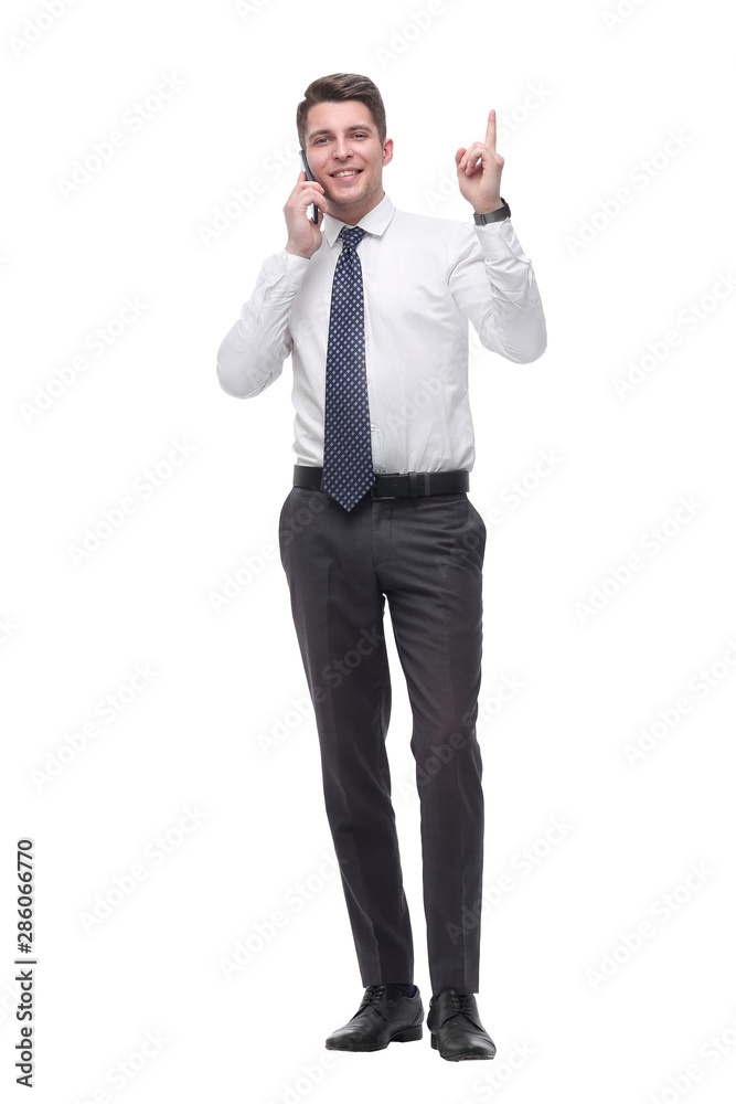attentive young businessman talking on mobile phone. isolated on white