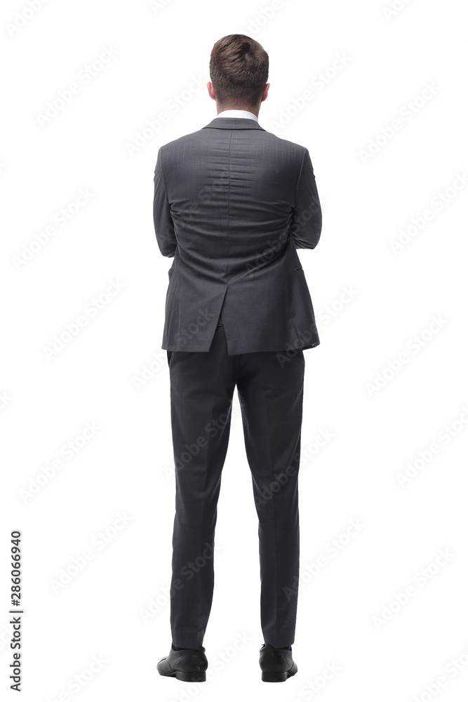 young businessman standing in front of a big white screen. isolated on white young businessman standing in front of a big white screen. isolated on white