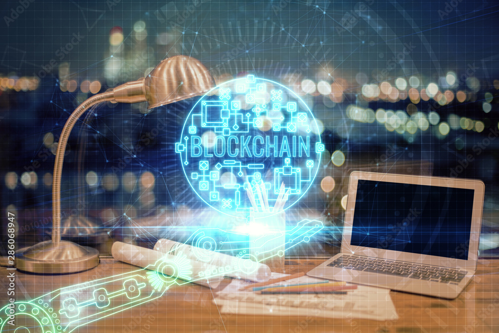 Double exposure of blockchain and crypto economy theme hologram and table with computer background. Concept of bitcoin cryptocurrency. Double exposure of blockchain and crypto economy theme hologram and table with computer background. Concept of bitcoin cryptocurrency.