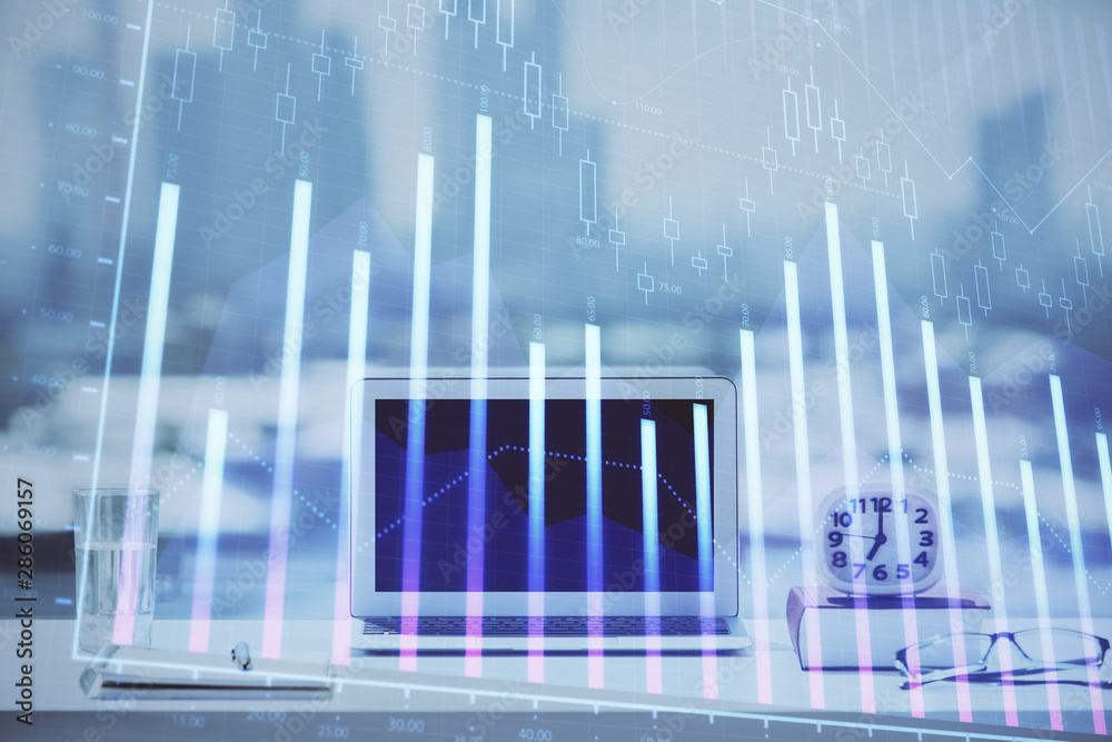Forex graph hologram on table with computer background. Multi exposure. Concept of financial markets. Forex graph hologram on table with computer background. Multi exposure. Concept of financial markets.