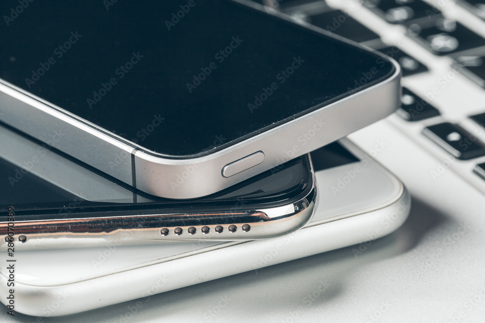 Laptop and mobile phone on the table. Workspace concept. Laptop and mobile phone on the table. Workspace concept.