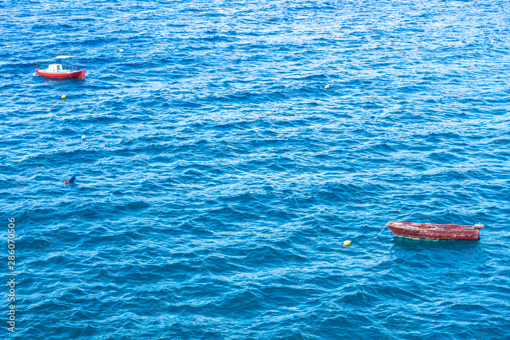 Fototapeta premium Small boat on sea water