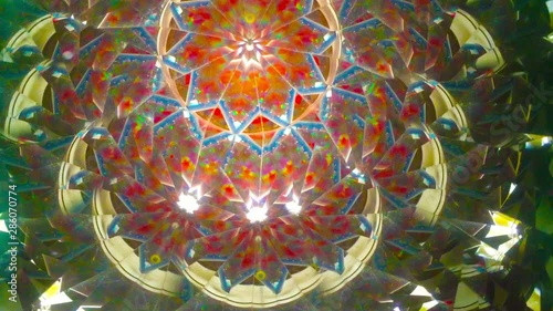 abstract fractal background - Real kaleidoscope background, no digital effect. Asymmetric background with white dots. Main colors: orange, green, yellow, azure