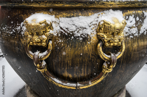 After the snow of the Forbidden City copper cylinder