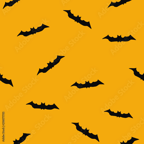 seamless halloween pattern with bats on an orange background