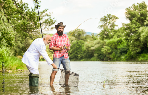 Selection of jobs. hobby of businessman. retirement fishery. happy fishermen. Good profit. friends men with fishing rod and net. Fly fishing adventures. retired dad and mature bearded son