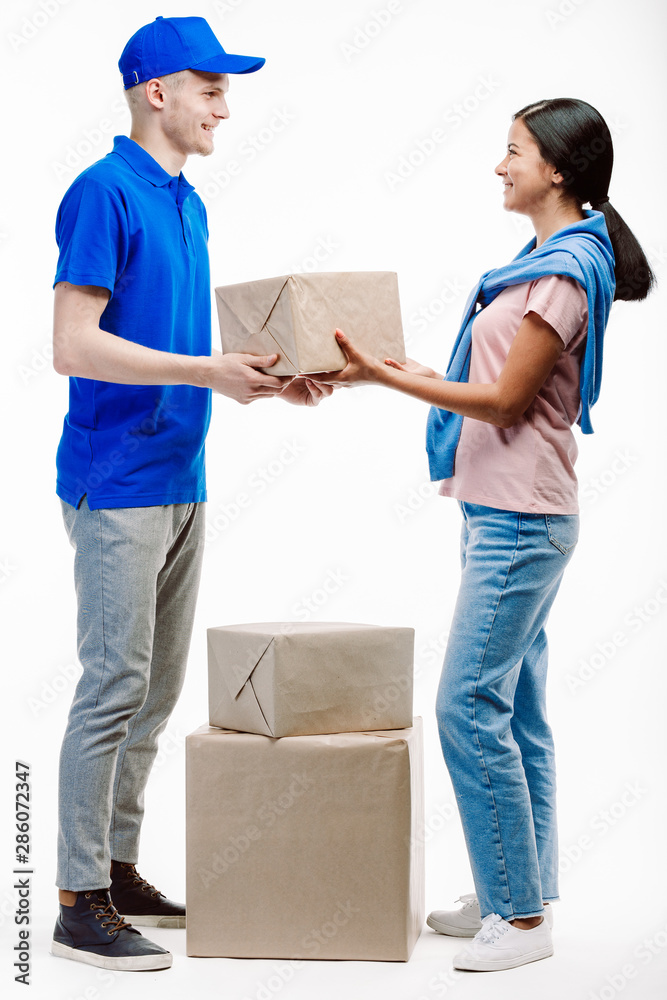 Postman takes parcels from the client at the post office. Postman takes parcels from the client at the post office.