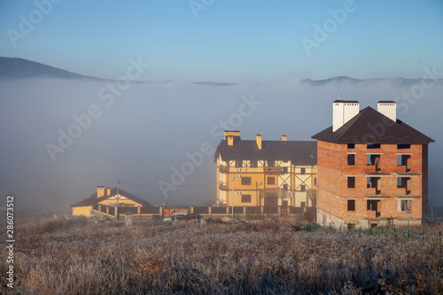 Buildings houses in the fog