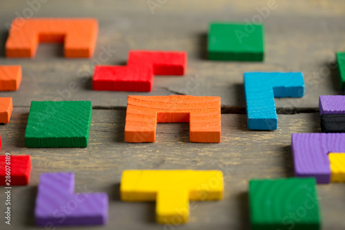 Creative solution for idea - business concept, jigsaw puzzle on the wooden desk