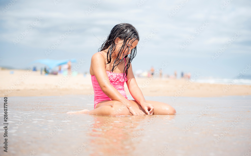 Little pretty girl on the shore of the beach Little pretty girl on the shore of the beach
