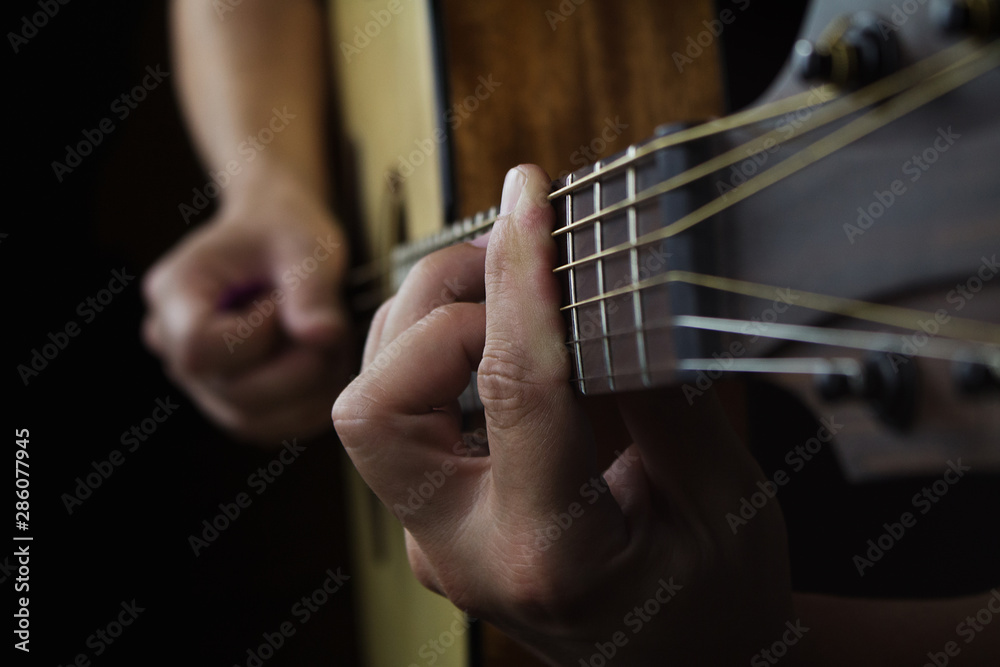 Acoustic Guitar Player Performing. Guitarist Playing In Music Studio Acoustic Guitar Player Performing. Guitarist Playing In Music Studio