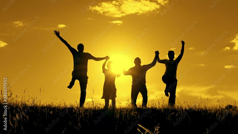 Silhouette of people, jubilation and jumping with show of hands. Silhouette of people, jubilation and jumping with show of hands.