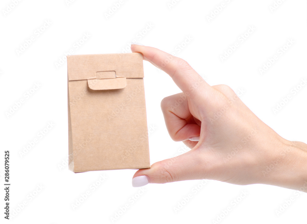 Cardboard brown package in hand on white background isolation Cardboard brown package in hand on white background isolation