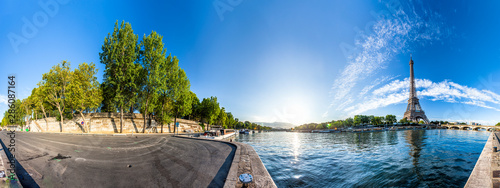 Photography Scenic panorama of the Eiffel Tower and the riverside of Seine in Paris, France