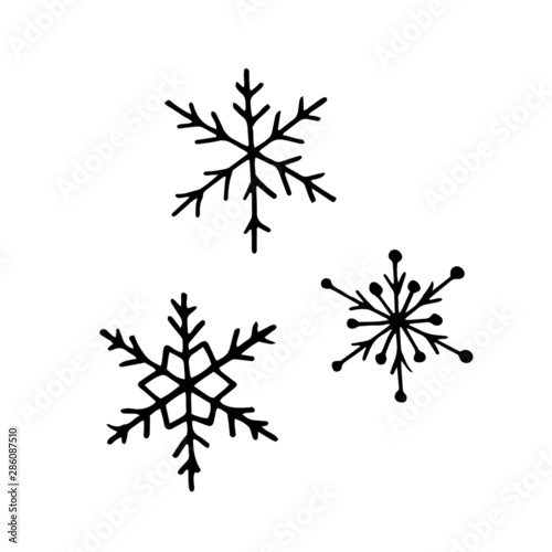 Hand drawn snowflake in doodle style. Set of snowflakes. Vector illustration.