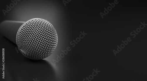 Macro shot of microphone on black glossy table with dof effect. © Foxstudio