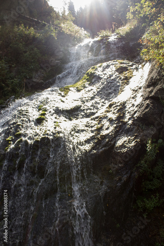 waterfall in mountains © Diliara