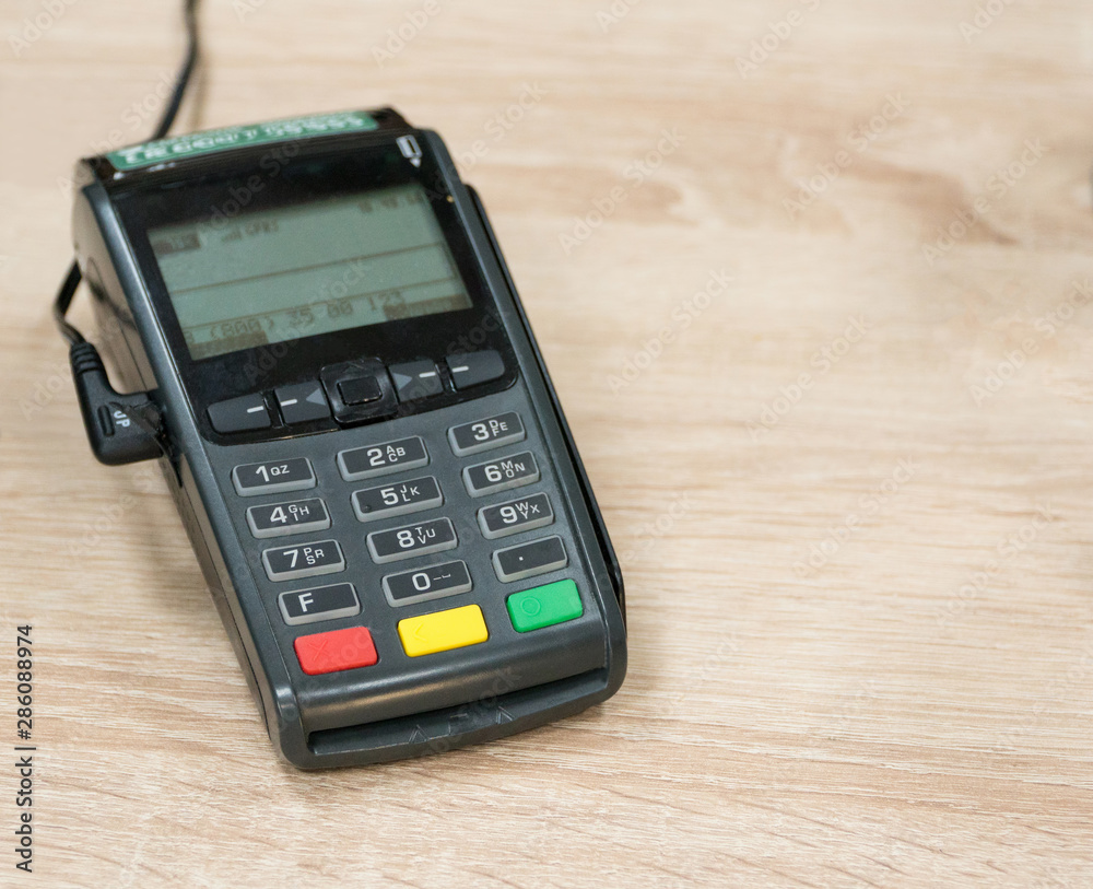 payment terminal on a wooden background