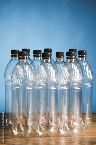 empty plastic bottles on blue background