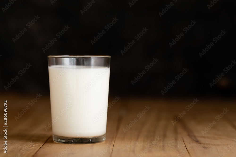 glass of milk against glass of milk against
