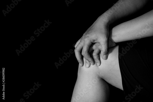 woman suffering from pain in knee