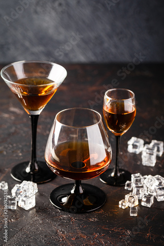 Set of strong alcoholic drinks in glasses