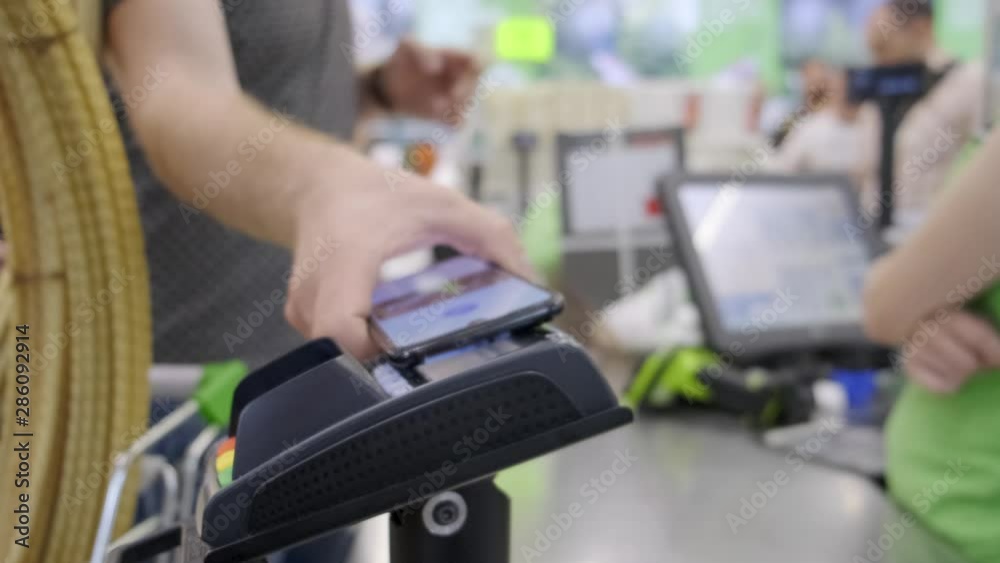 The buyer in the store pays for the goods by phone, contactless payment. The buyer in the store pays for the goods by phone, contactless payment.