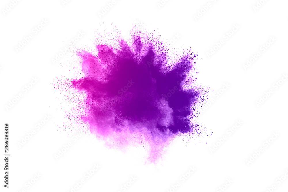 Obraz Zamrozić ruch fioletowego koloru proszku wybuchającego na białym tle.