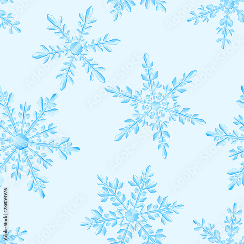 Christmas seamless pattern of large complex translucent snowflakes in light blue colors on white background. Transparency only in vector format