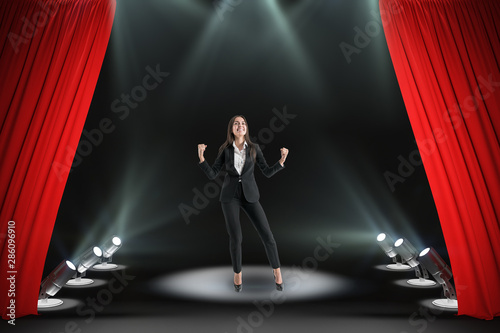 Happy businesswoman on stage