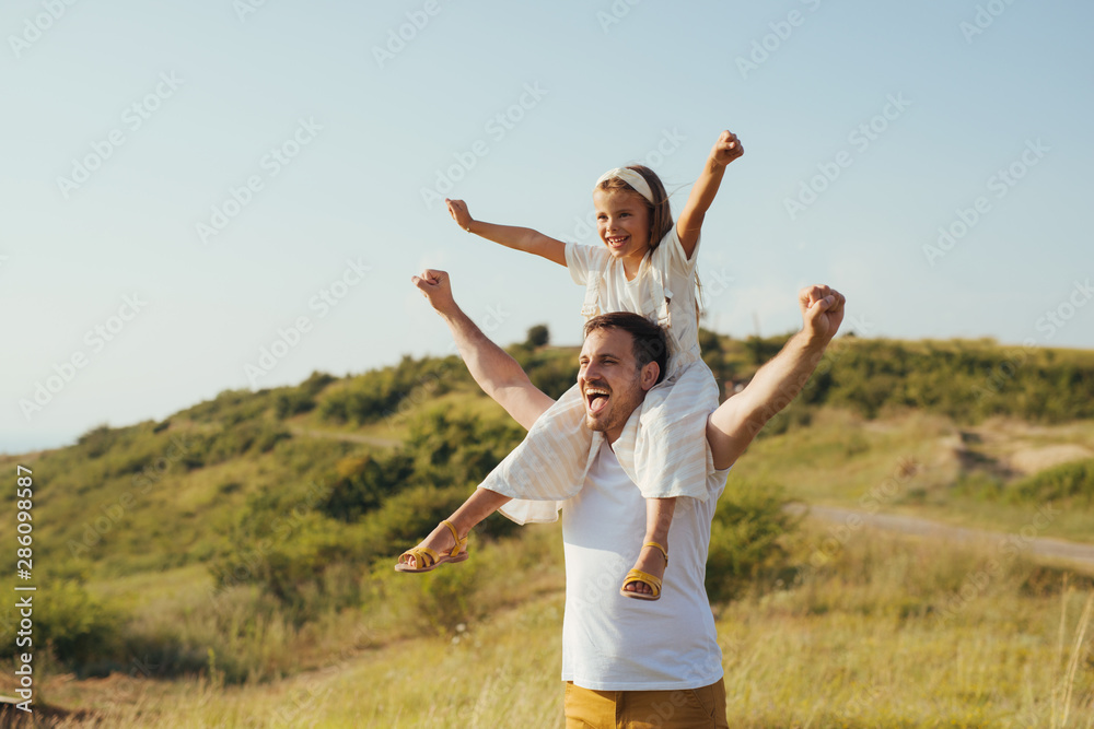 Father and daughter have fun in nature Father and daughter have fun in nature
