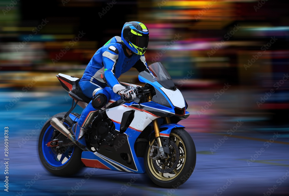 Motorcycle rider racing in blue colors with motion blur