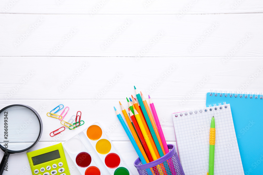Back to school concept on white wooden background, top view Back to school concept on white wooden background, top view