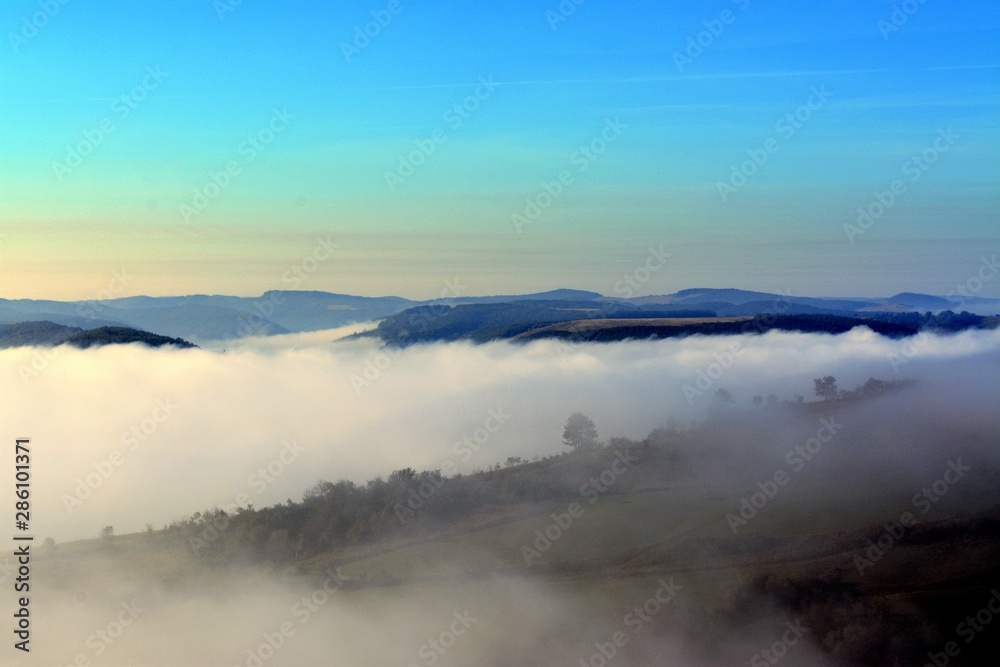 fog between hills in the morning