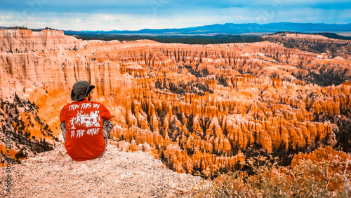 A young man watching the national park from Bryce Point photo