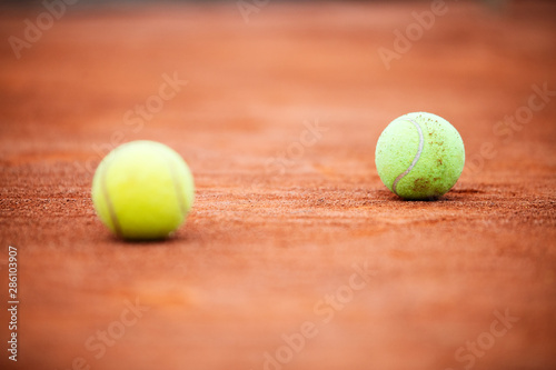 Close up of tennis balls on tennis court. Sport concept