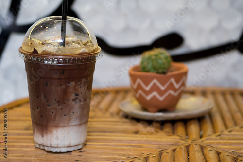 Iced mocha coffee on wooden table