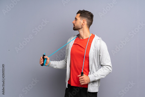 Young sport man with jumping rope