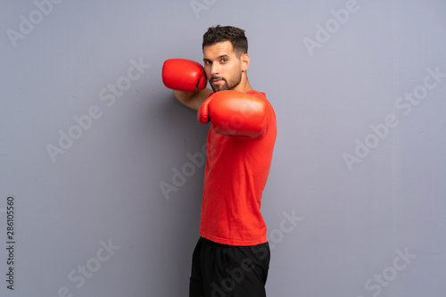 Young sport man with boxing gloves