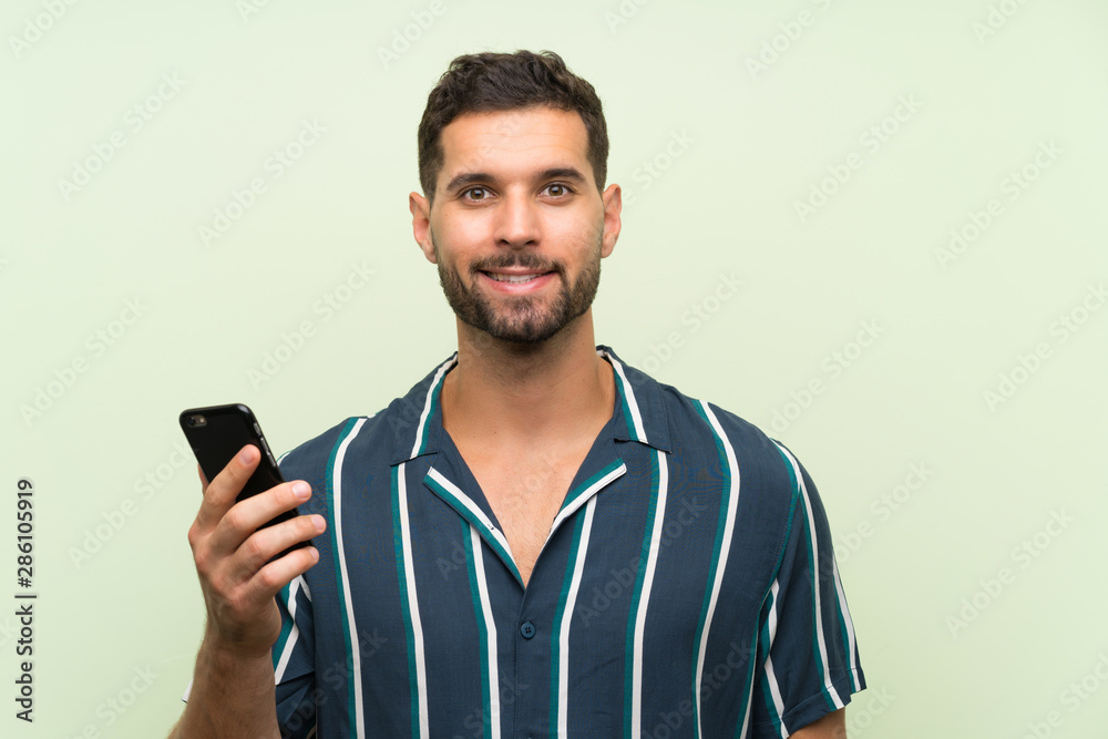 Young handsome man with a mobile smiling a lot Young handsome man with a mobile smiling a lot
